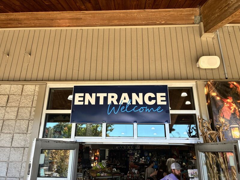 An entrance sign welcomes visitors inside.