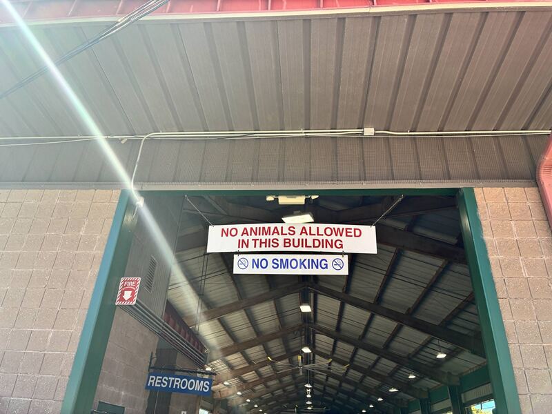 Rules posted above an entrance to the selling area.