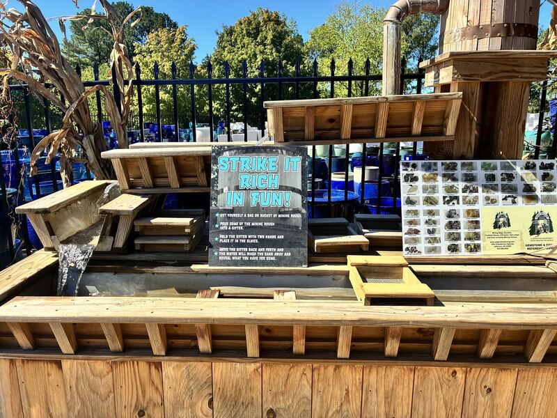 Garden furniture and display pieces outside.