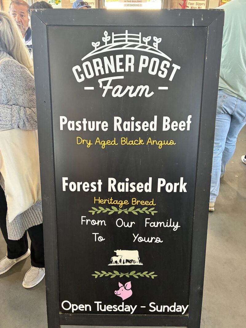 A Corner Post Farm sign inside the market.
