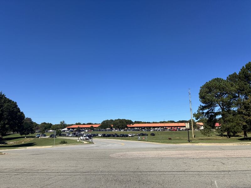 An open view of the market grounds under a clear blue sky.