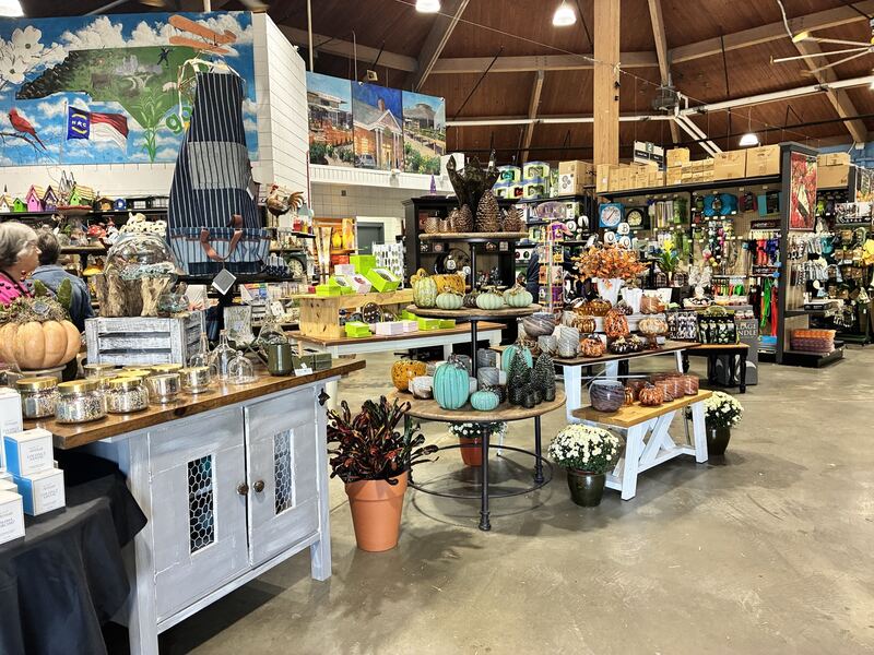 Tables and shelves filled with garden and home merchandise.