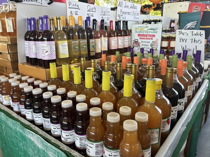 Bottles and jars arranged across a specialty food display.