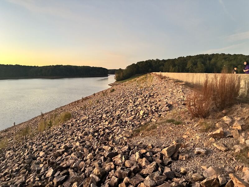 The rocky lake-side embankment.
