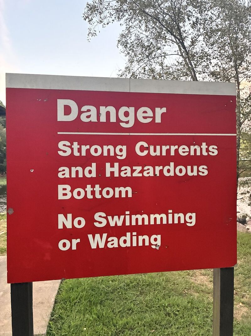The warning photographed at the tailrace.